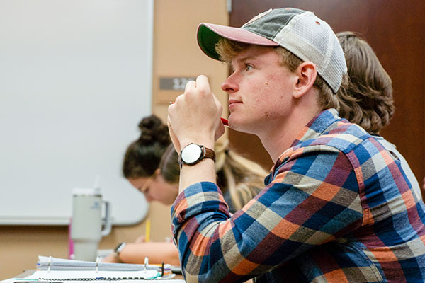 male student in class