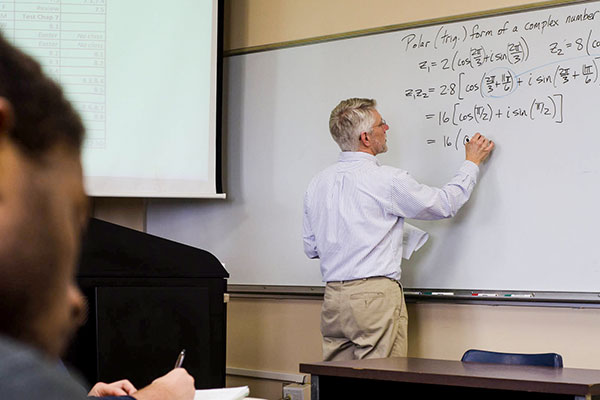 professor at white board