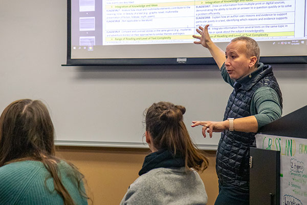 professor teaching students in classroom