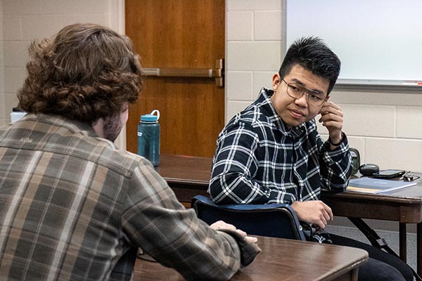 students speaking in classroom