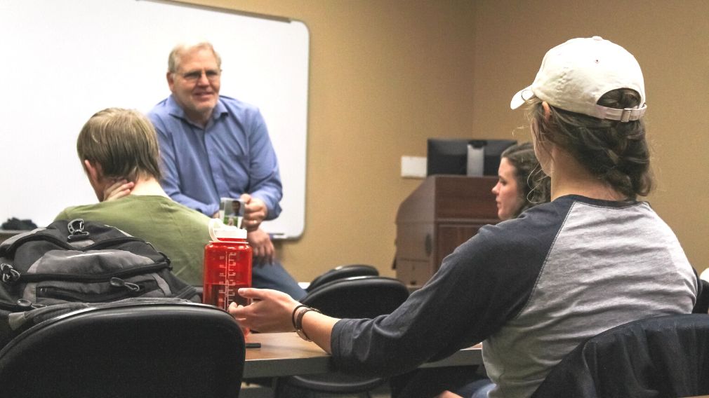 Dr. Corbett engaging a student in class