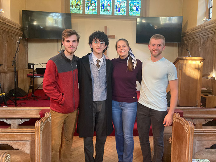 students standing together in church