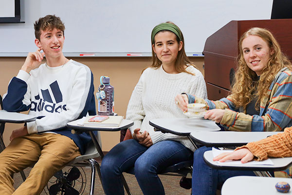 male and female students engaged in conversation